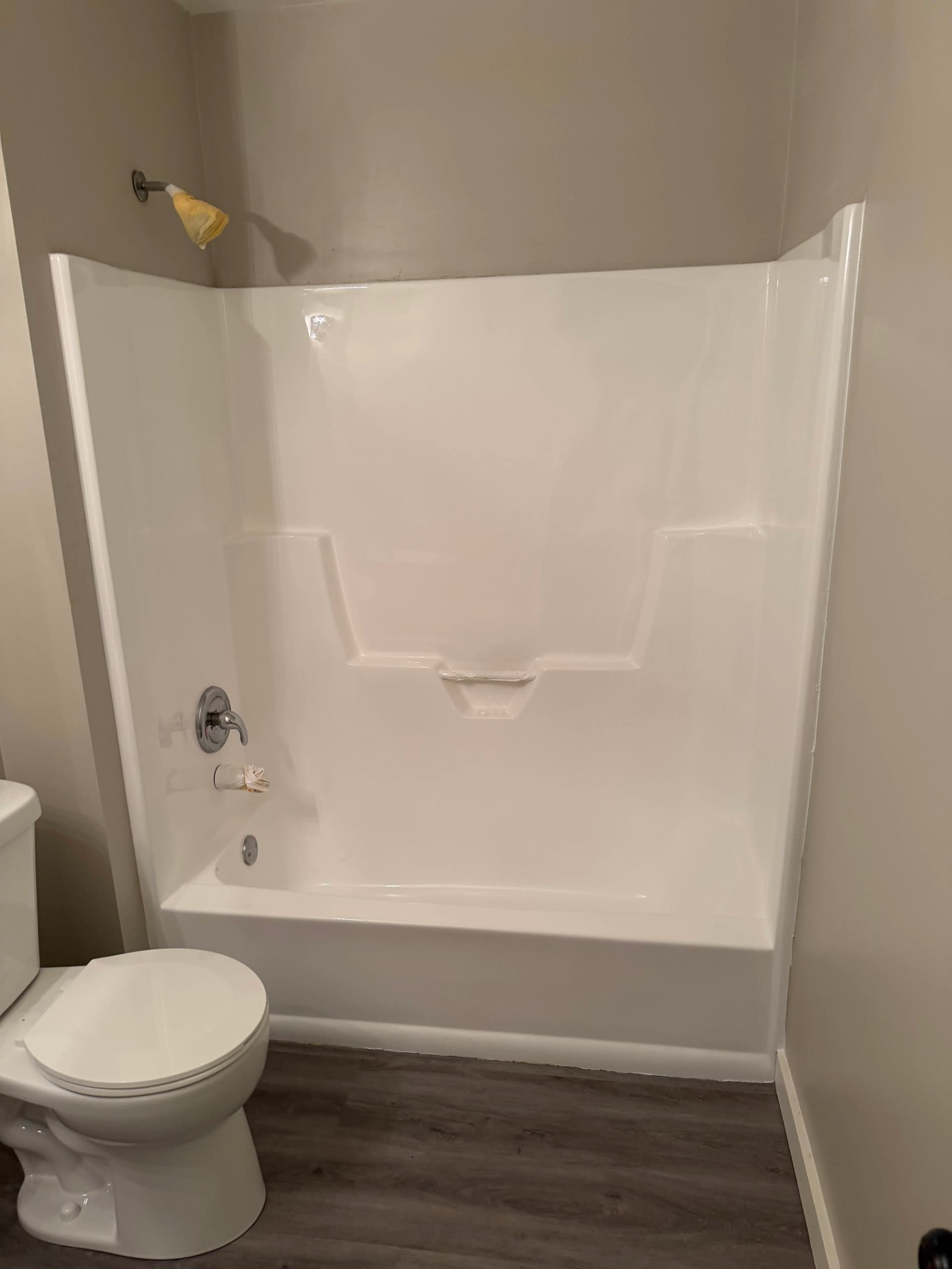 Gallery photos for Badly Stained Tub Surround Gets a Clean White Finish: Image #1